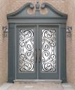 Wood doors with wrought iron Houston logo